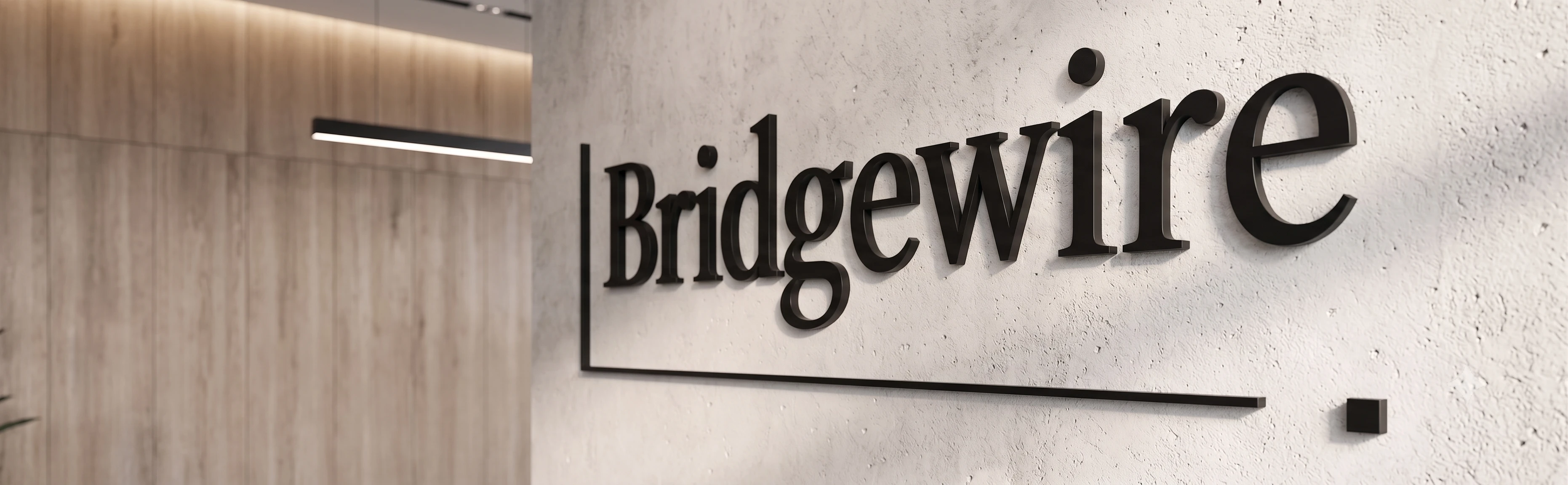 The Bridgewire wordmark, set into the studio wall
