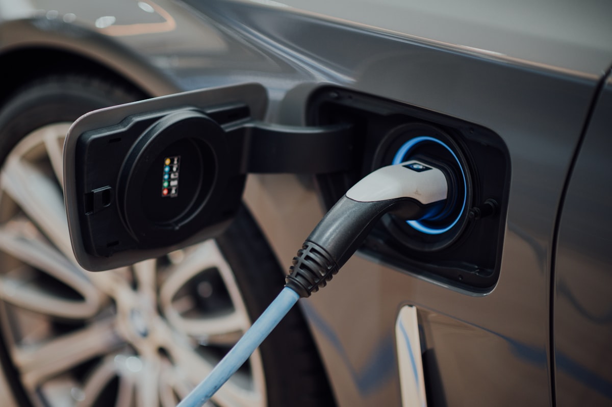 EV charging plug inserted into a car