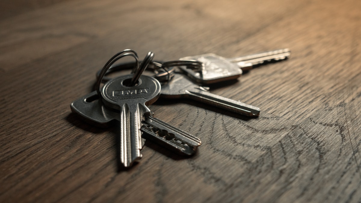 Set of car keys on a wooden table